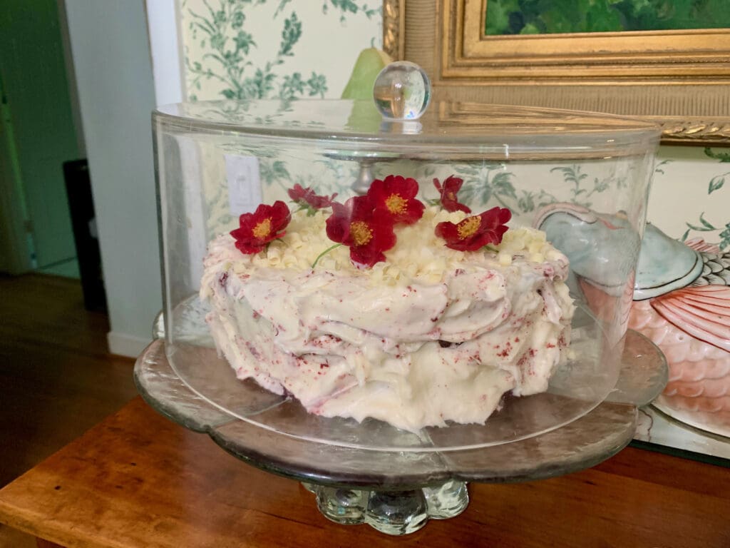 Red velvet cake with white chocolate and flowers.