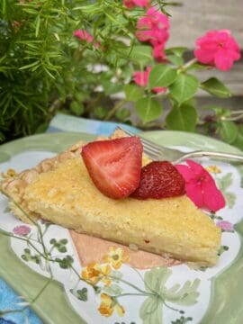 Slice of lemon pie with strawberries.