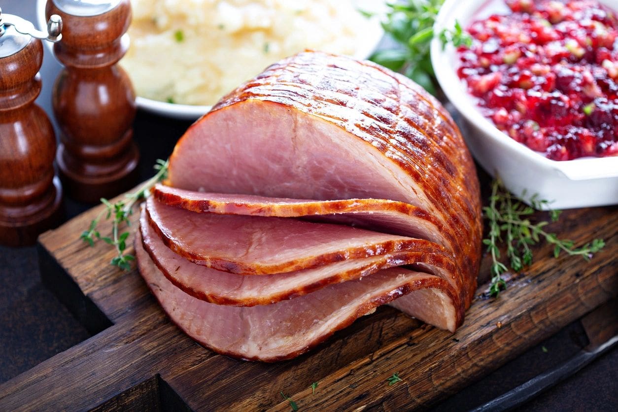 A close up of ham on a cutting board