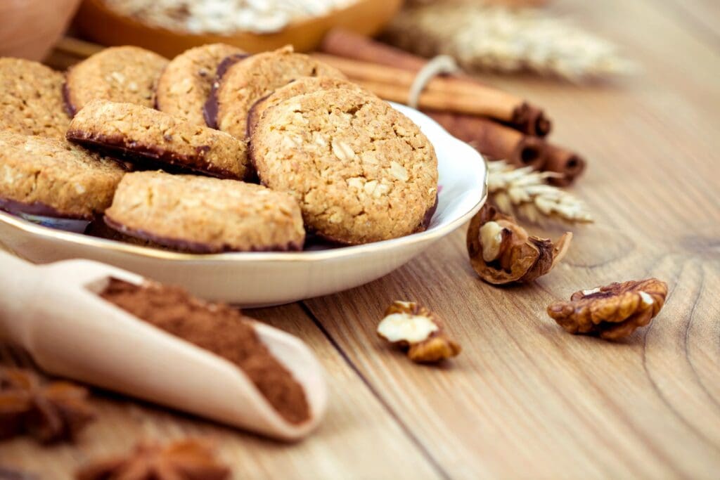 A bowl of cookies and some nuts on the table