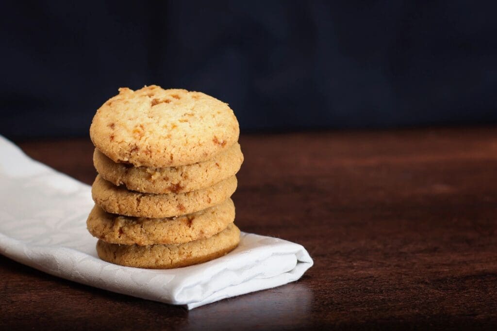 A stack of cookies on top of a napkin.