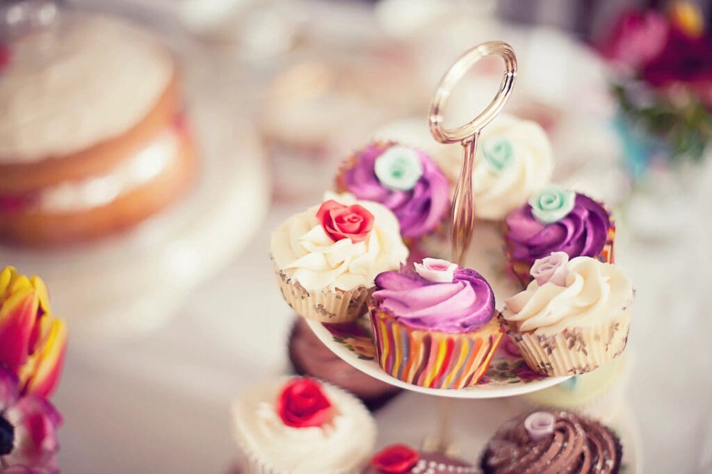 A close up of several cupcakes on a plate