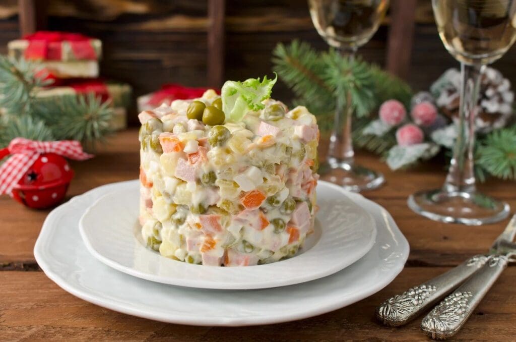 A white plate with a salad on it