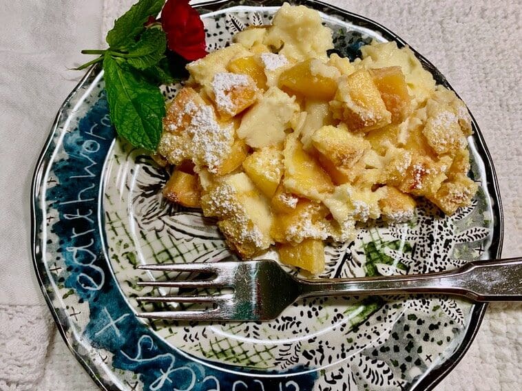 A plate with some food on it and a fork