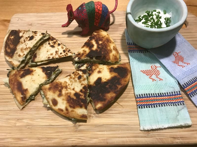 A wooden cutting board with some food on it