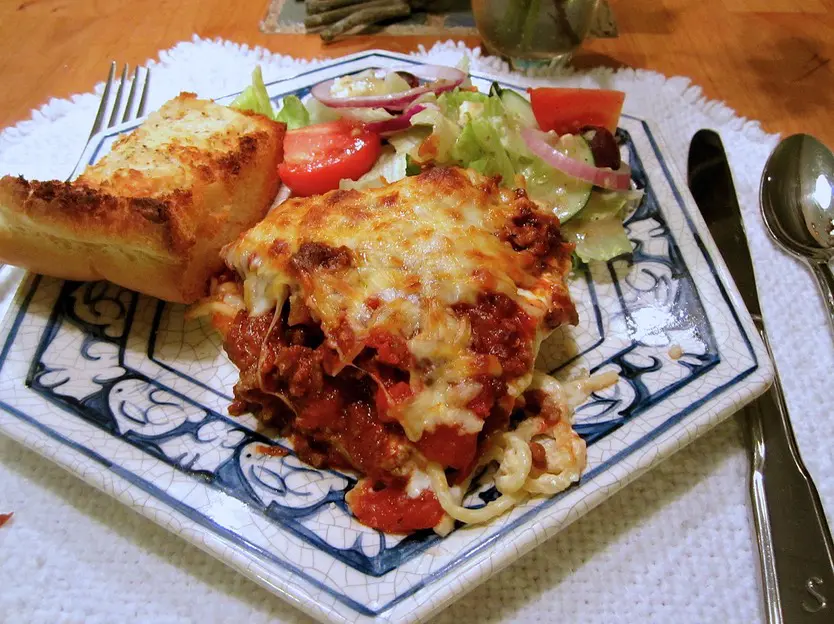 A plate of food with some type of meat and vegetables