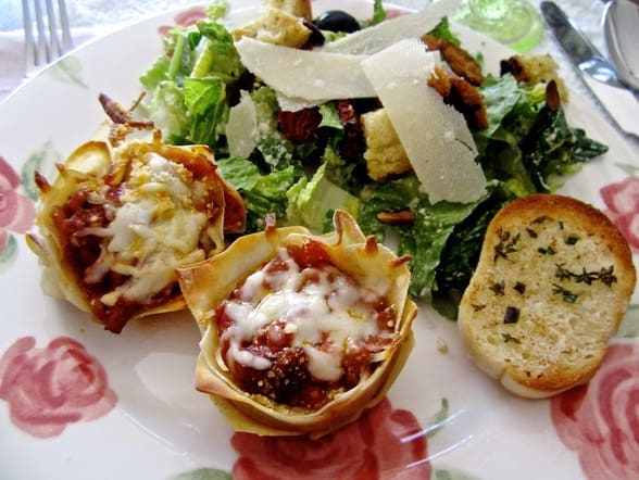 A plate of food with some bread and salad