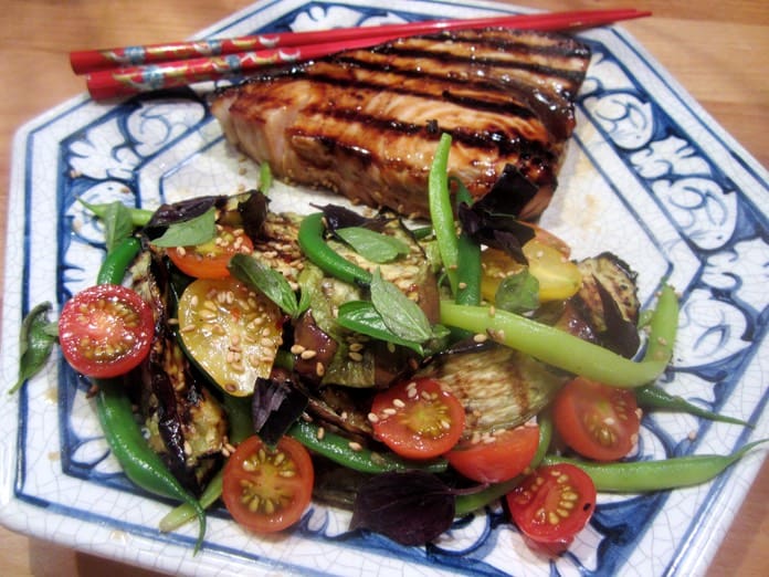 A plate of food with meat and vegetables on it.