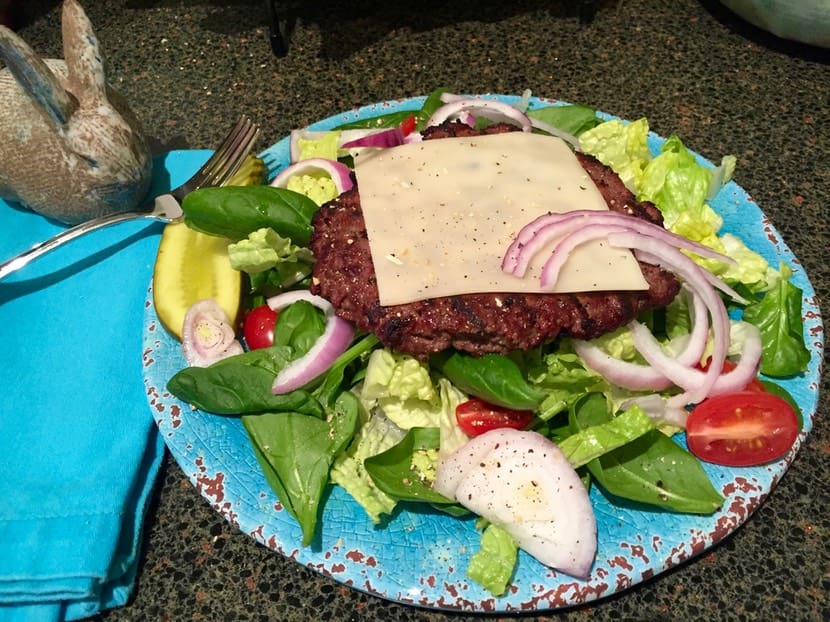 A plate of food with meat and vegetables on it.