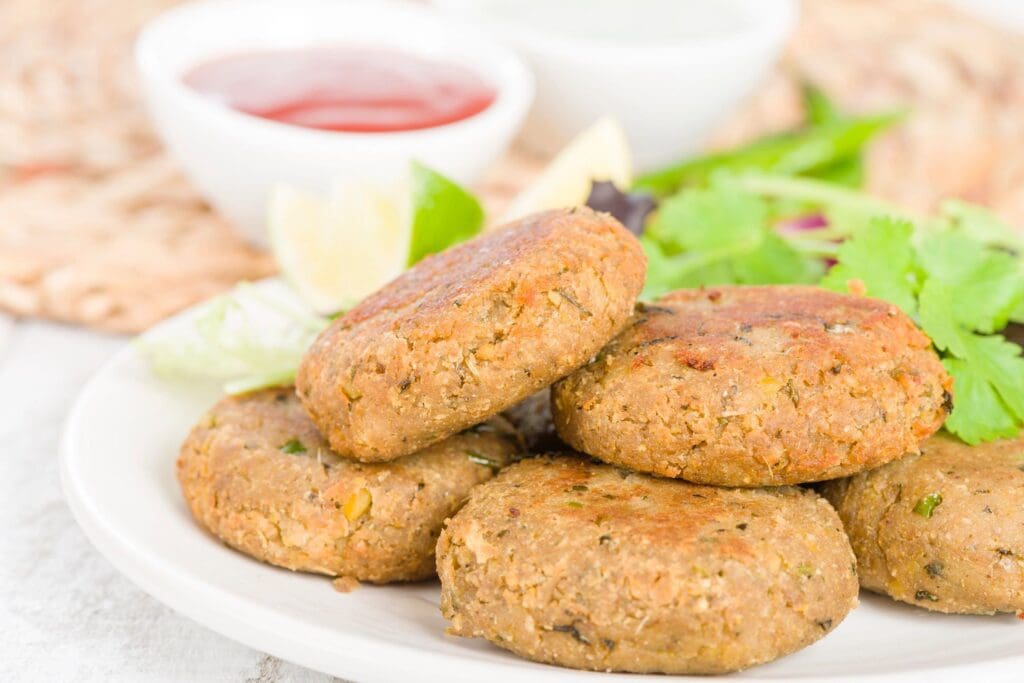 A plate of food with some meat patties