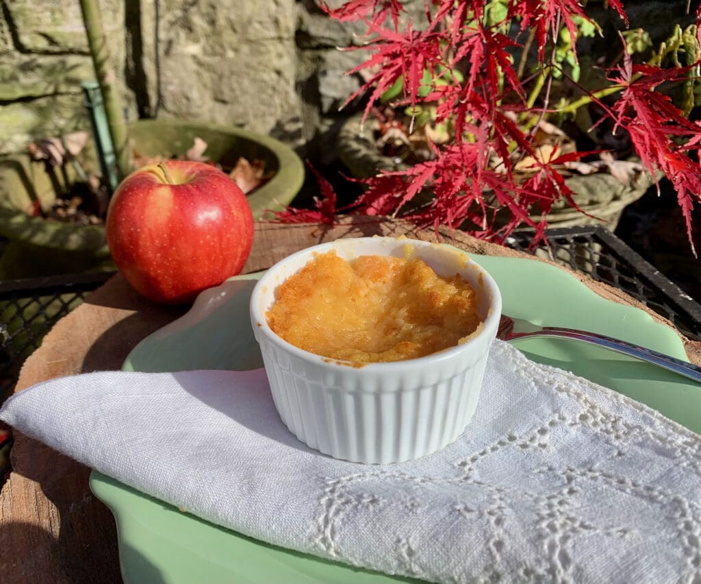 Apple crisp in a white ramekin.