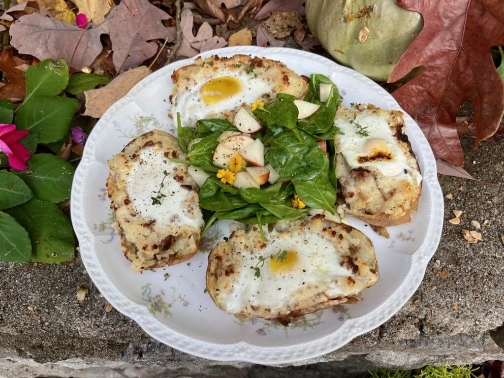 Potato skins with eggs and salad.