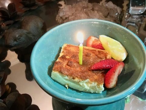 Birthday cake with candle and fruit