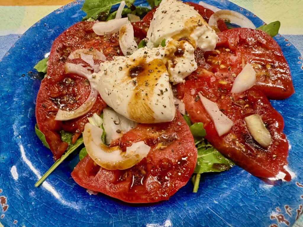 Tomato and burrata salad with balsamic glaze.