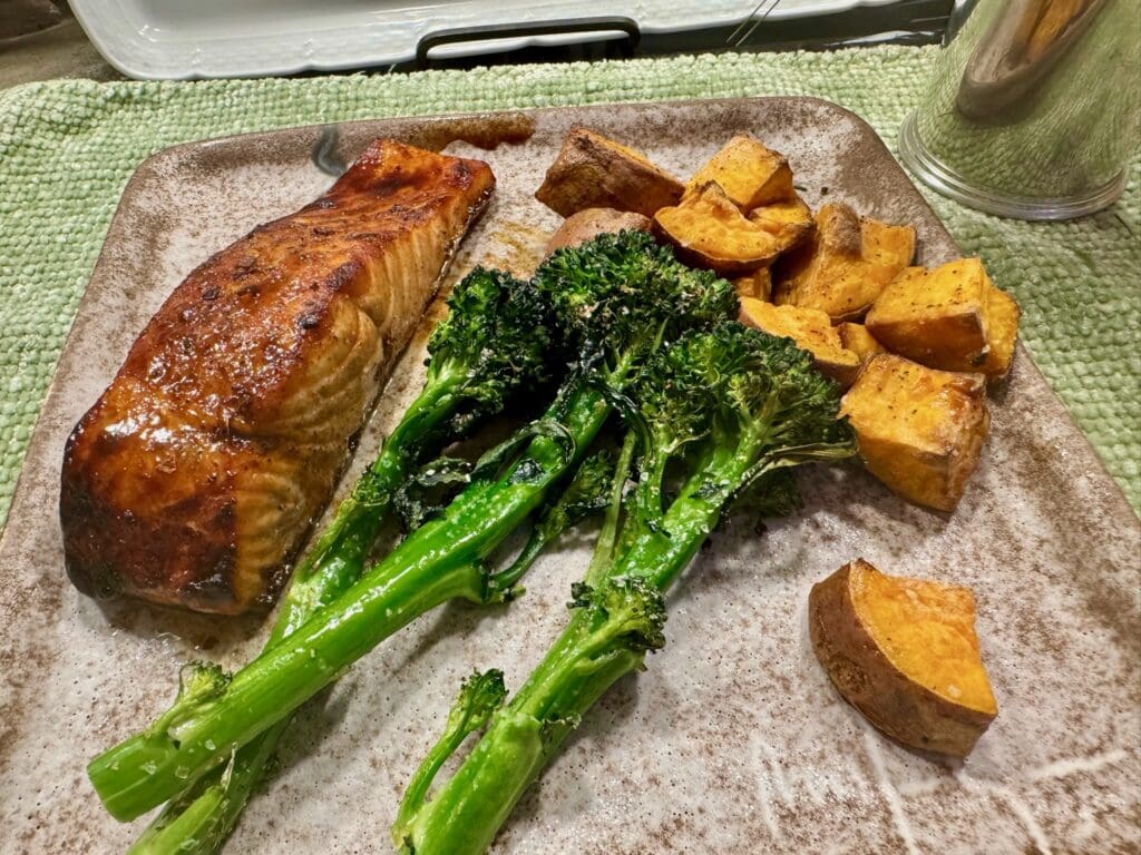 Glazed salmon, broccoli, and sweet potato.