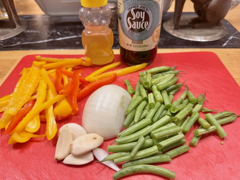 Chopped vegetables, garlic, soy sauce, and honey.