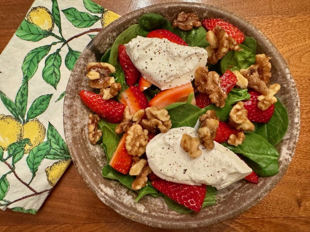 Spinach salad with strawberries and goat cheese.