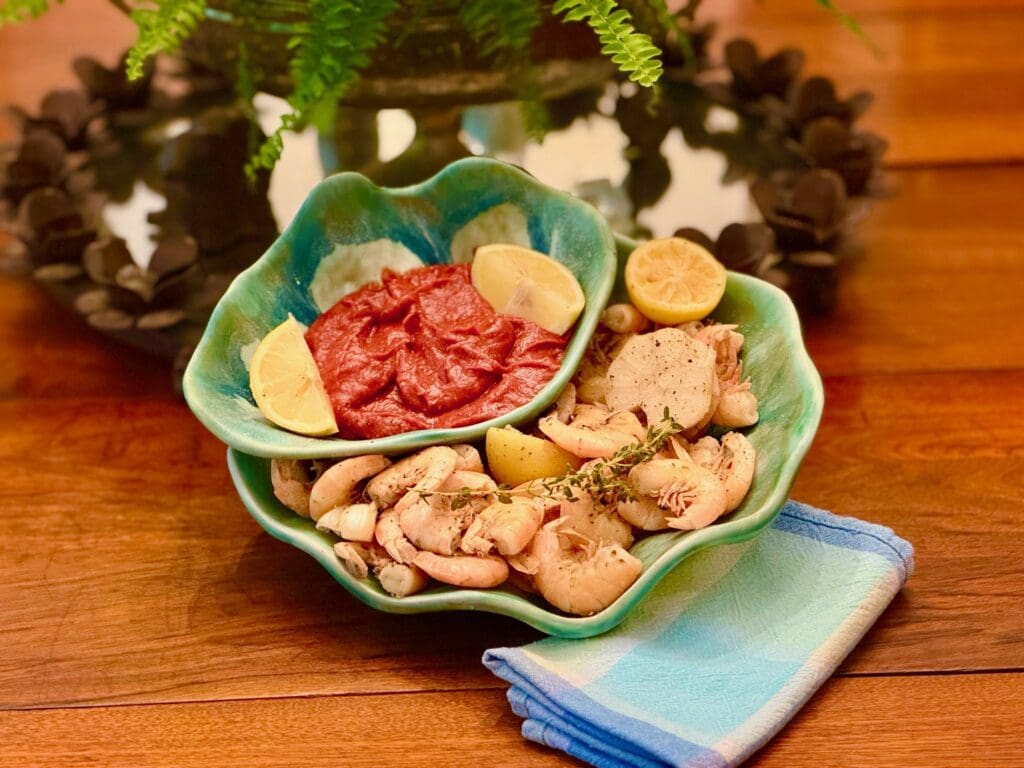 Chicken dish with sauce and lemon slices.