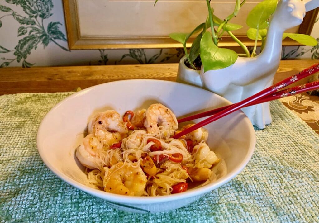 Shrimp and rice noodles in a bowl.