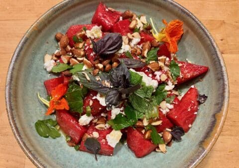 Watermelon salad with almonds and herbs.