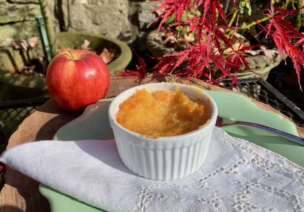 Apple crisp in a white ramekin.