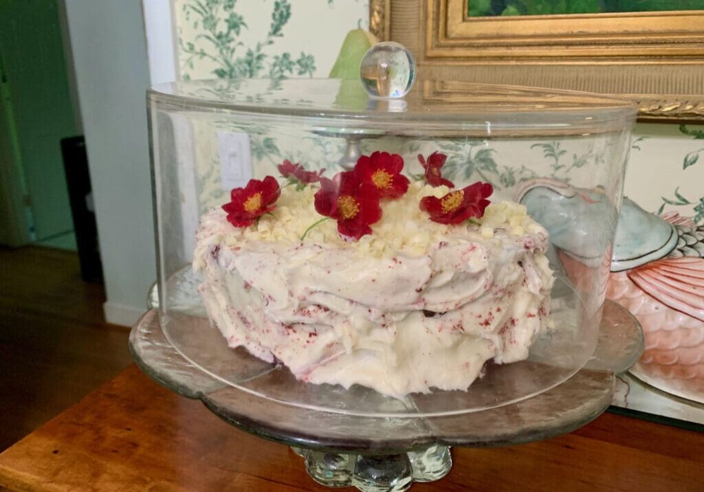 Red velvet cake with white chocolate and flowers.