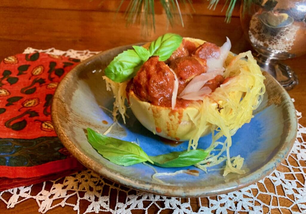 Meatballs in spaghetti squash with basil.