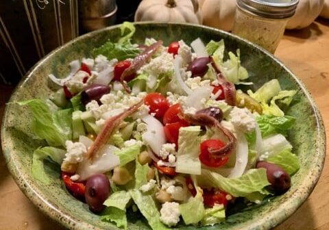 Green salad with anchovies and feta cheese.