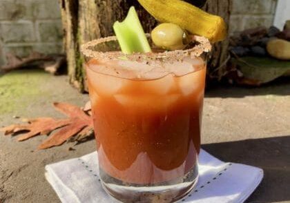 Bloody Mary with celery, olives, and garnish.