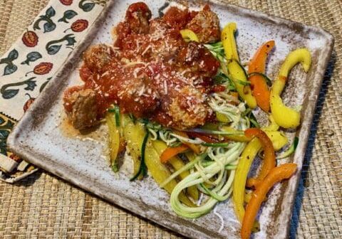 Meatballs with zucchini noodles and peppers.