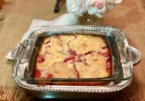 Strawberry cobbler in a silver dish.