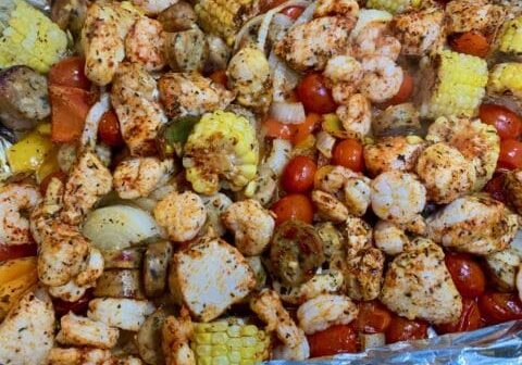 Shrimp, chicken, and vegetable foil packet.