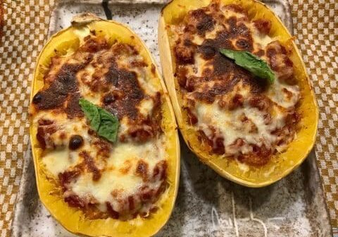 Baked spaghetti squash with cheese and basil.