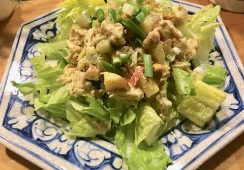 Chicken salad with lettuce on a plate.