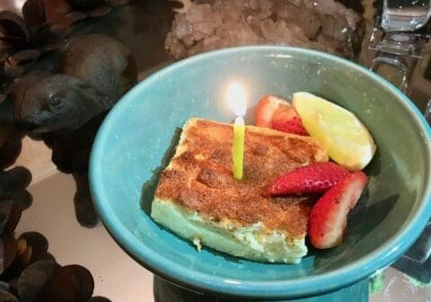 Birthday cake with candle and fruit