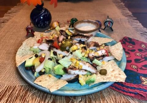 Chicken and corn salad on tortilla chips.