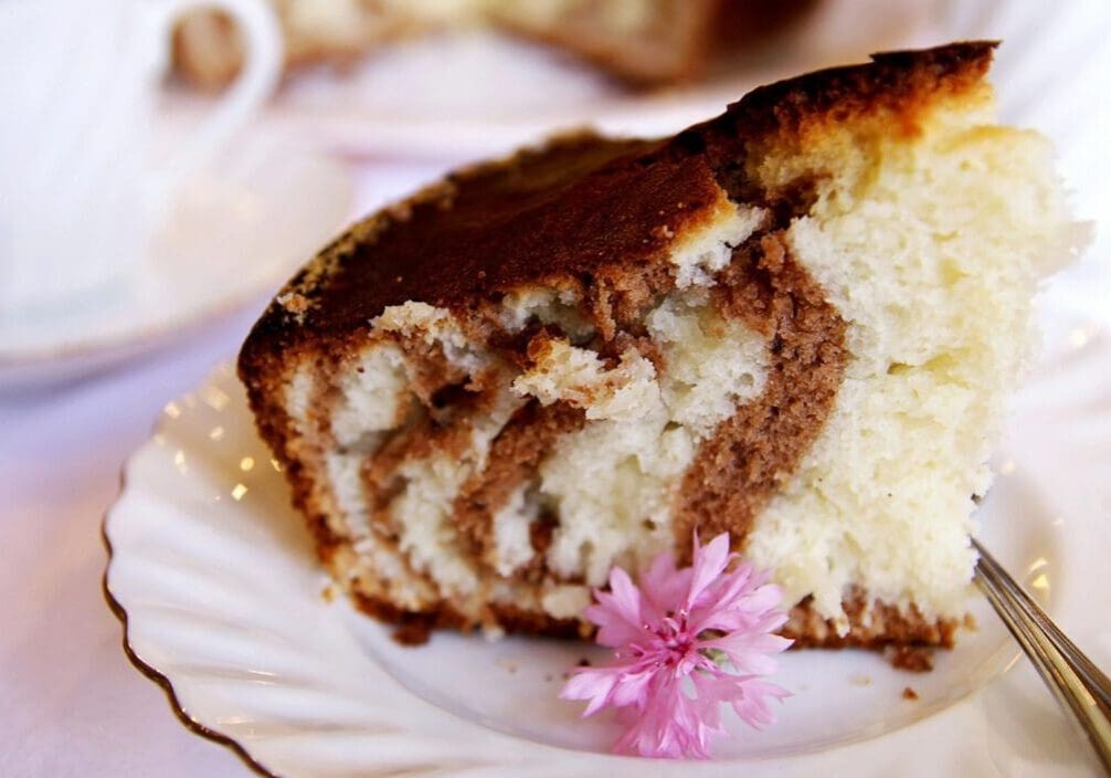 A piece of cake sitting on top of a white plate.