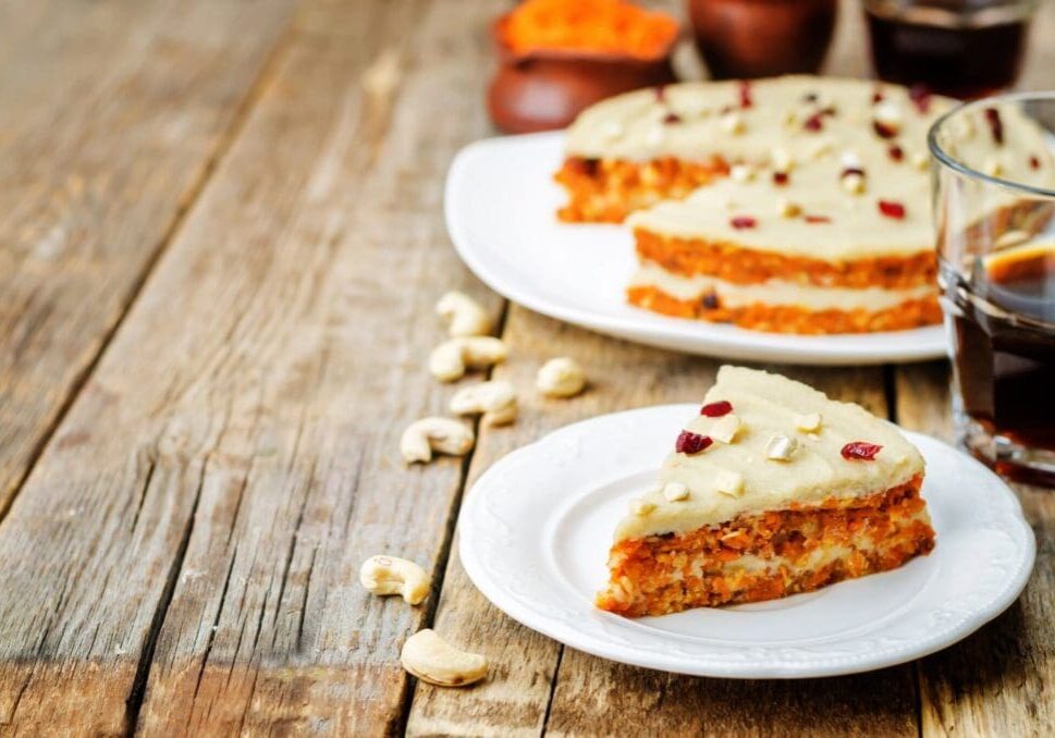 Two plates of food on a table with some crackers