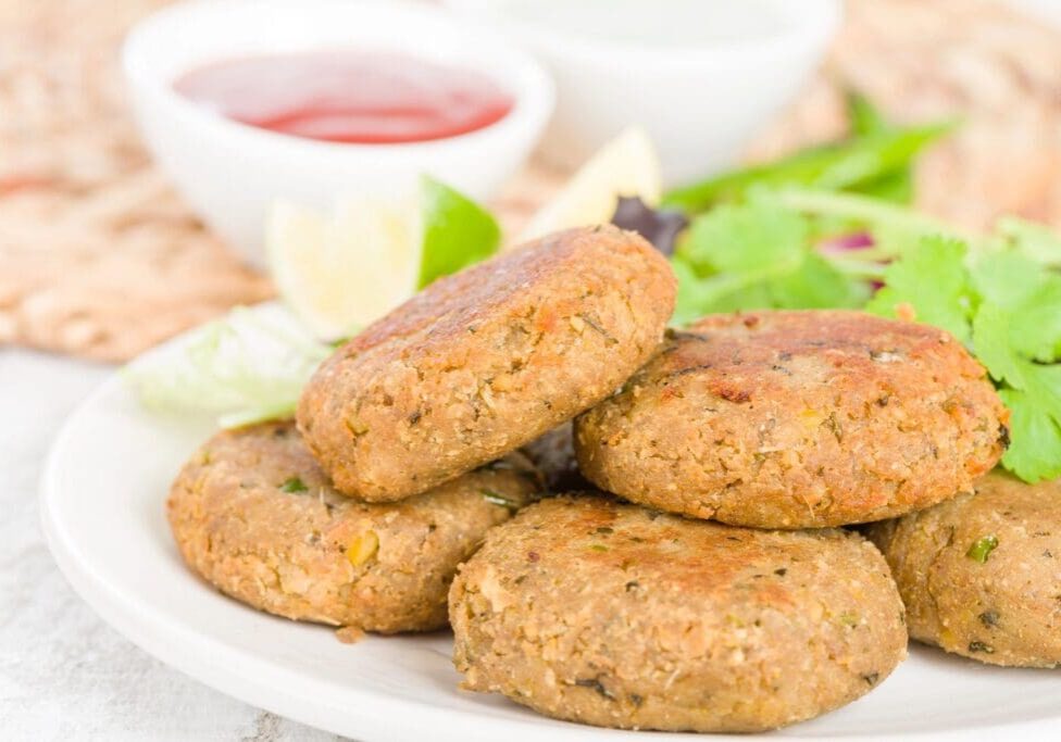 A plate of food with some meat patties