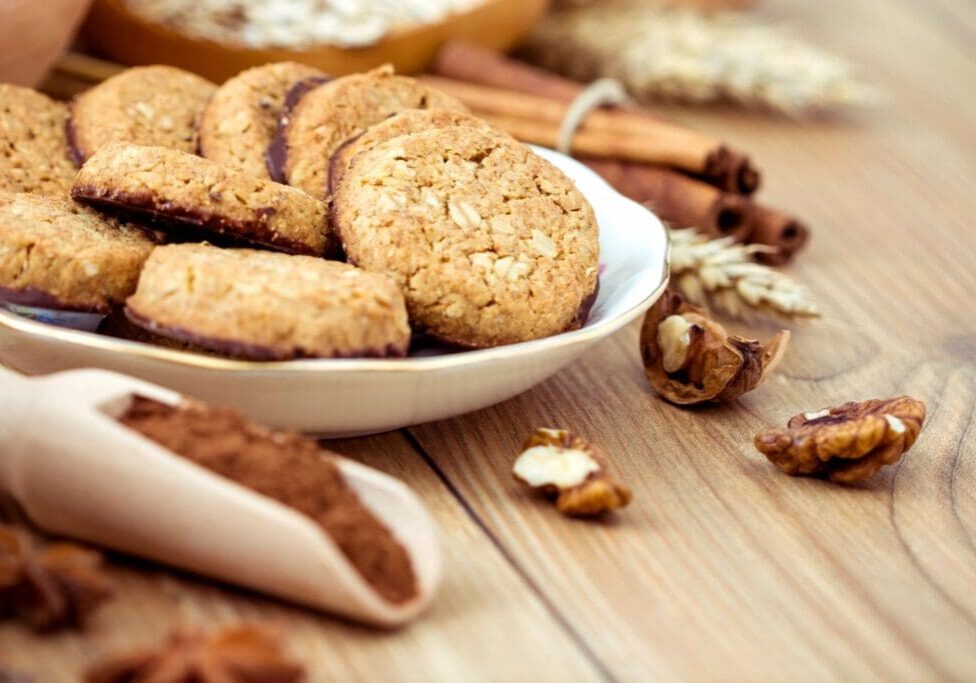 A bowl of cookies and some nuts on the table