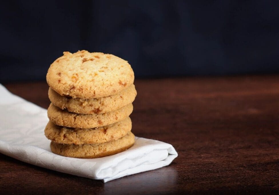 A stack of cookies on top of a napkin.