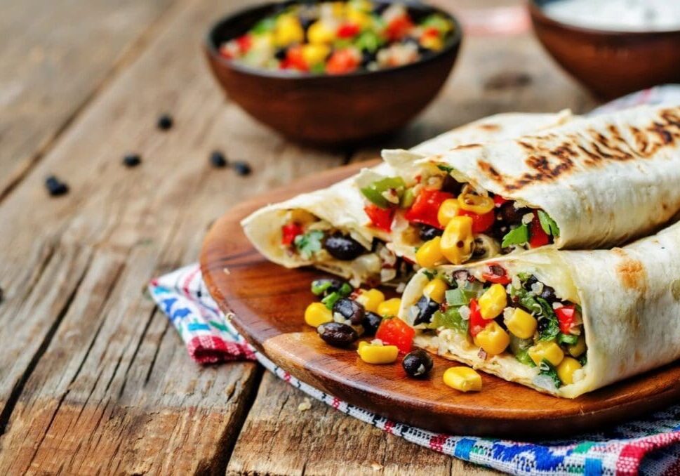 A wooden table with some food on it