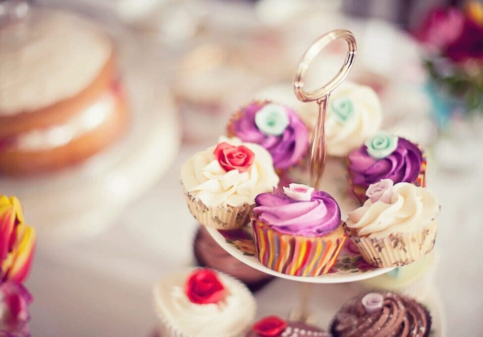 A close up of several cupcakes on a plate