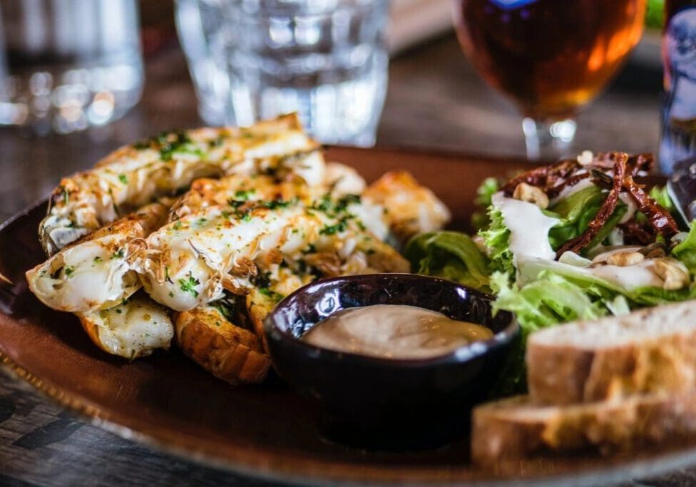 A plate of food with some bread and sauce on it