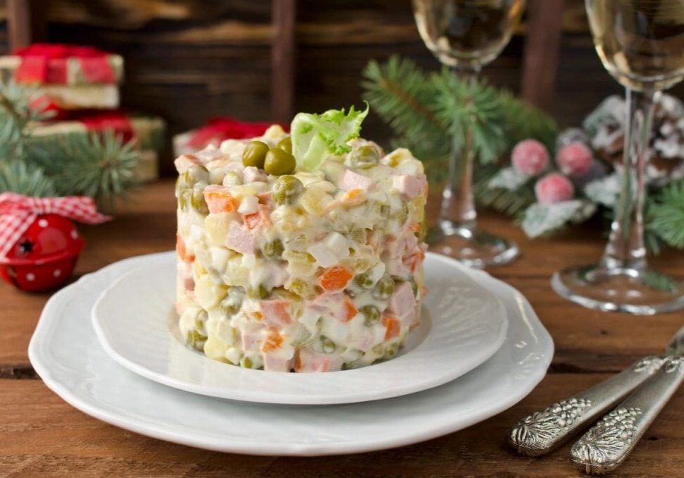 A white plate with a salad on it