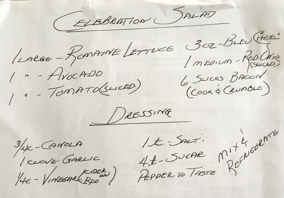 A handwritten menu for an establishment salad.