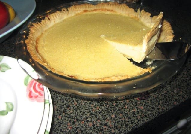 A pie with one piece missing in the middle of it.