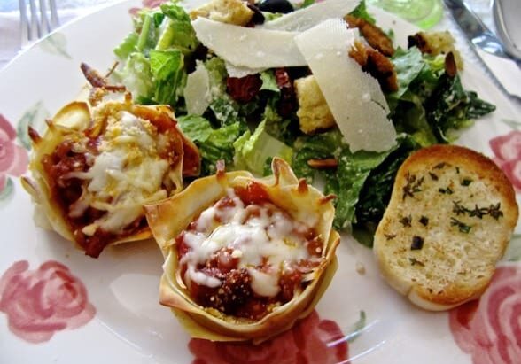 A plate of food with some bread and salad