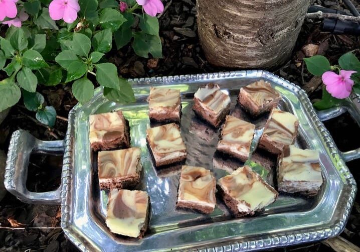 A tray of brownies on top of a table.