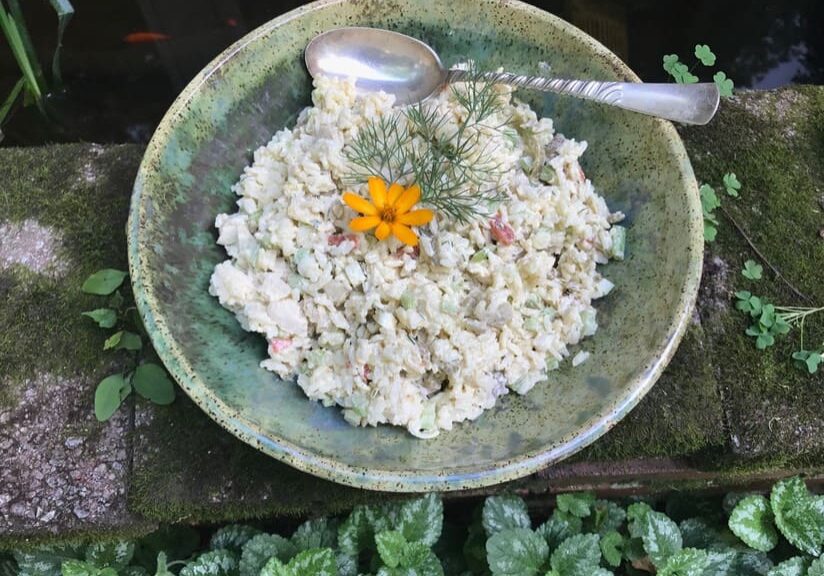 A bowl of rice with a spoon in it